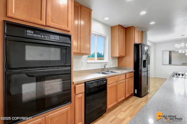 2321 Lusardi Point Cir, Anchorage, AK 99515 - kitchen with black appliances, light countertops, a chandelier, recessed lighting, and hanging light fixtures