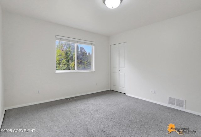 2321 Lusardi Point Cir, Anchorage, AK 99515 - unfurnished bedroom featuring carpet and a closet