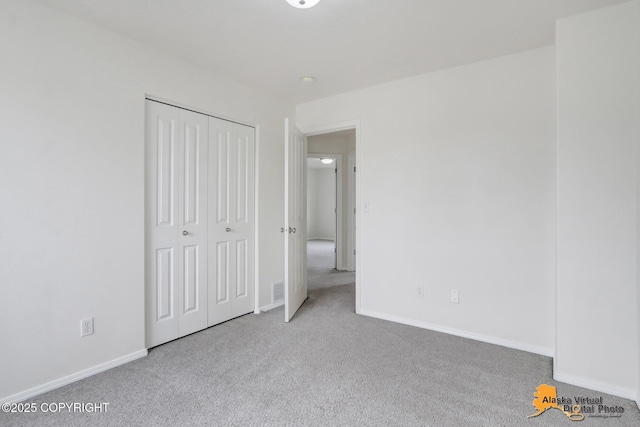 2321 Lusardi Point Cir, Anchorage, AK 99515 - unfurnished bedroom featuring carpet flooring and a closet