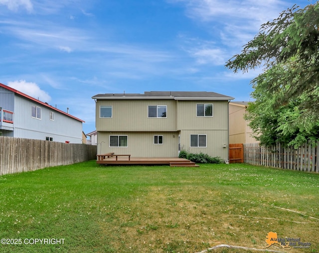 2321 Lusardi Point Cir, Anchorage, AK 99515 - back of property featuring a wooden deck and a fenced backyard