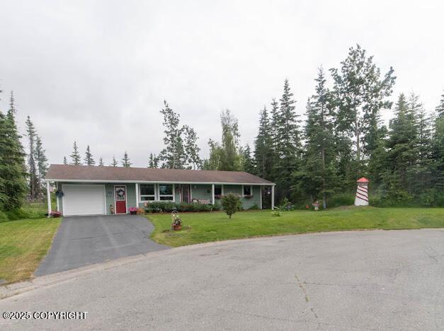 282 Marydale Ct, Soldotna, AK 99669 - ranch-style house featuring a garage, driveway, and a front yard
