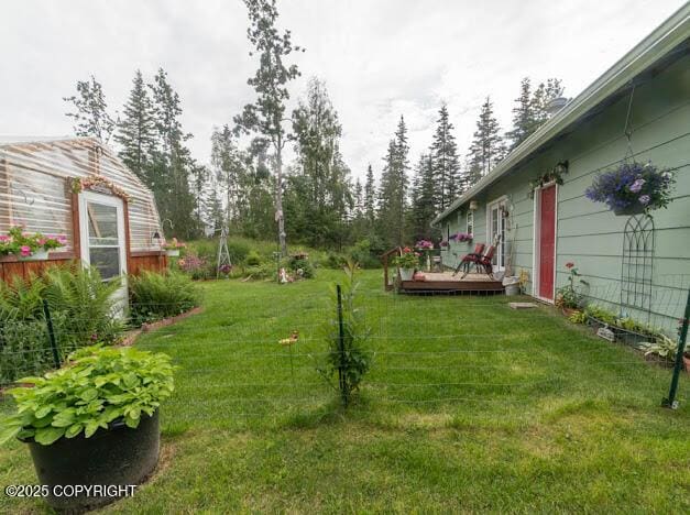282 Marydale Ct, Soldotna, AK 99669 - view of grassy yard featuring a wooden deck