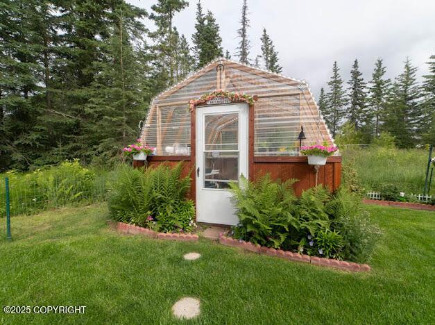 282 Marydale Ct, Soldotna, AK 99669 - view of greenhouse with a lawn