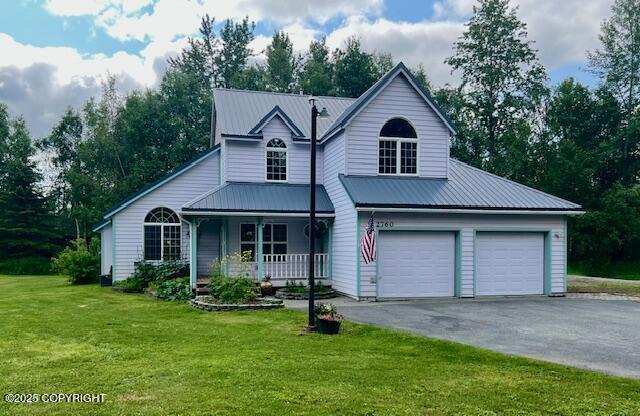 2760 W Stable Cir, Wasilla, AK 99623 - traditional-style house featuring covered porch, driveway, and a front yard