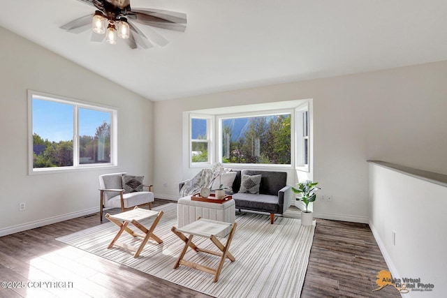 14795 E Hearthstone Dr, Palmer, AK 99645 - living area with healthy amount of natural light, wood finished floors, vaulted ceiling, and ceiling fan