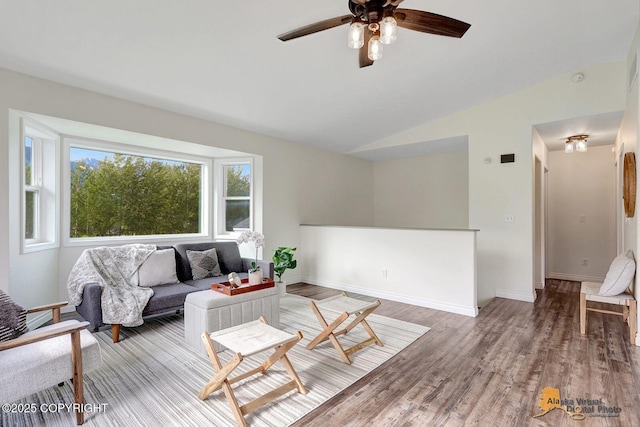 14795 E Hearthstone Dr, Palmer, AK 99645 - living area with a ceiling fan, wood finished floors, and vaulted ceiling