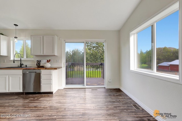 14795 E Hearthstone Dr, Palmer, AK 99645 - kitchen with dishwasher, dark wood-type flooring, dark countertops, decorative light fixtures, and white cabinets