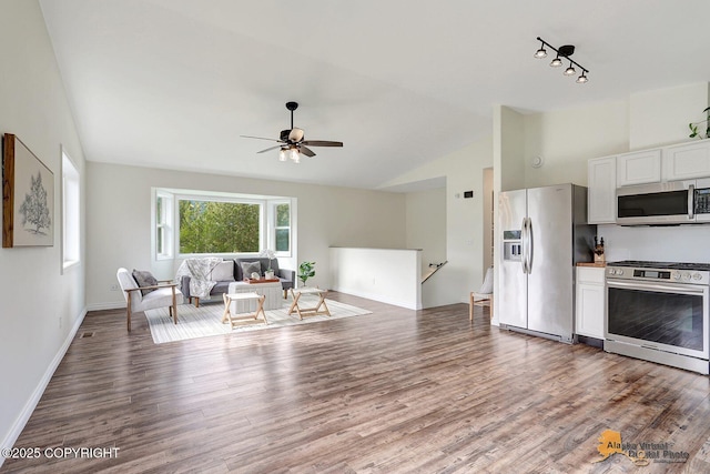14795 E Hearthstone Dr, Palmer, AK 99645 - living area with lofted ceiling, wood finished floors, ceiling fan, and track lighting