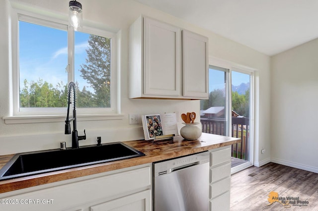 14795 E Hearthstone Dr, Palmer, AK 99645 - kitchen with dishwasher, light wood-style flooring, white cabinetry, and butcher block countertops