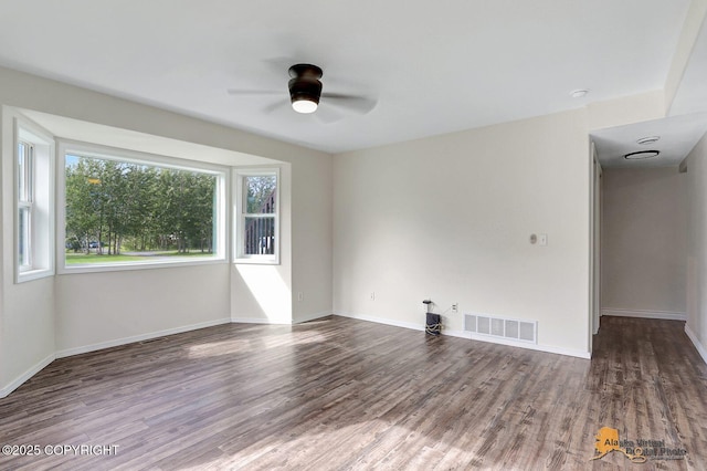 14795 E Hearthstone Dr, Palmer, AK 99645 - empty room featuring a ceiling fan and wood finished floors