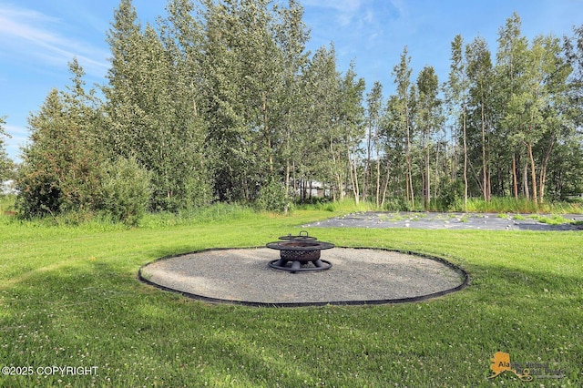 14795 E Hearthstone Dr, Palmer, AK 99645 - view of grassy yard featuring a fire pit