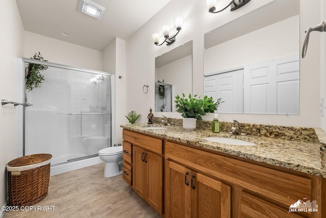 23011 Sherman St # 24, Chugiak, AK 99567 - bathroom featuring double vanity and a stall shower