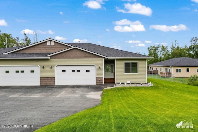 23011 Sherman St # 24, Chugiak, AK 99567 - view of front of house featuring asphalt driveway and a garage