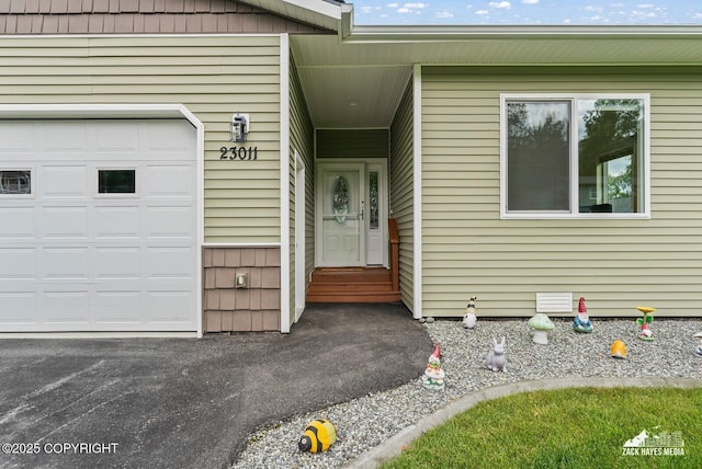 23011 Sherman St # 24, Chugiak, AK 99567 - doorway to property with a garage