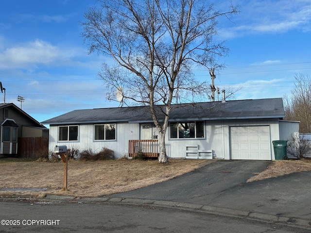 2541 Lyvona Ln, Anchorage, AK 99502 - ranch-style house featuring an attached garage and driveway