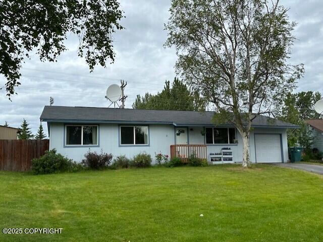 2541 Lyvona Ln, Anchorage, AK 99502 - ranch-style home featuring a garage and asphalt driveway