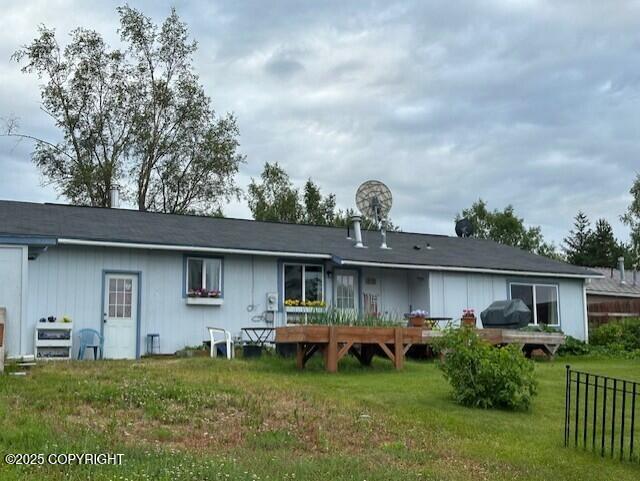 2541 Lyvona Ln, Anchorage, AK 99502 - rear view of house featuring a deck