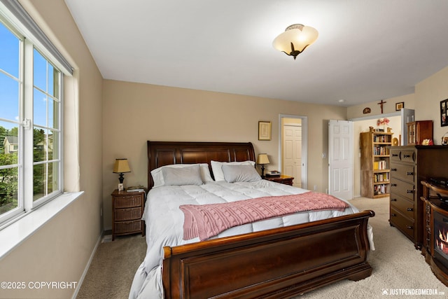 2431 Harbor Landing Cir, Anchorage, AK 99515 - bedroom featuring light carpet and multiple windows