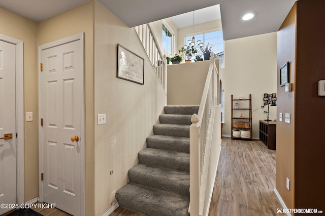 2431 Harbor Landing Cir, Anchorage, AK 99515 - stairs featuring wood finished floors and recessed lighting