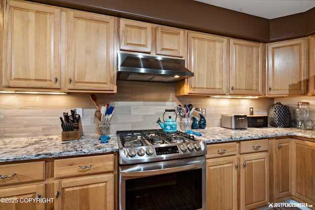 2431 Harbor Landing Cir, Anchorage, AK 99515 - kitchen featuring stainless steel gas stove, under cabinet range hood, light brown cabinetry, and decorative backsplash