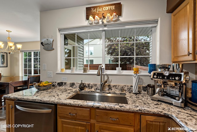 2431 Harbor Landing Cir, Anchorage, AK 99515 - kitchen featuring stainless steel dishwasher, a chandelier, light stone counters, and pendant lighting