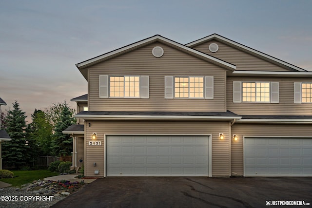 2431 Harbor Landing Cir, Anchorage, AK 99515 - traditional-style house with a garage and asphalt driveway