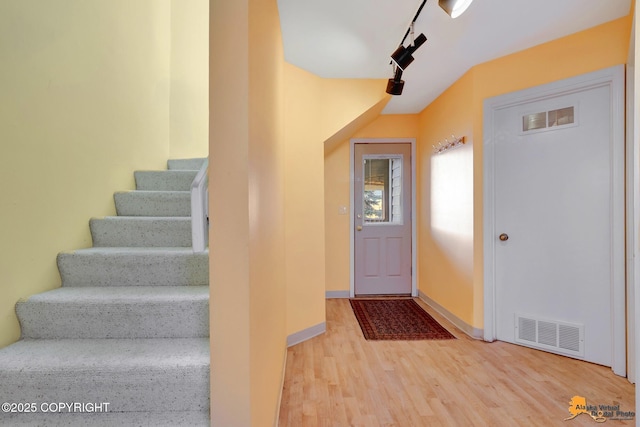 1854 Buccaneer Pl, Anchorage, AK 99501 - entryway featuring wood finished floors and stairway