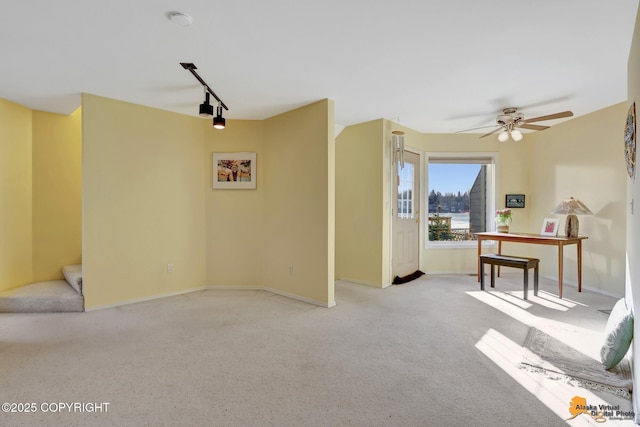 1854 Buccaneer Pl, Anchorage, AK 99501 - unfurnished room featuring track lighting, carpet flooring, and a ceiling fan