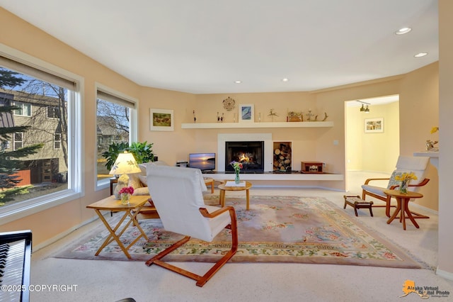 1854 Buccaneer Pl, Anchorage, AK 99501 - living room featuring recessed lighting, carpet floors, and a lit fireplace