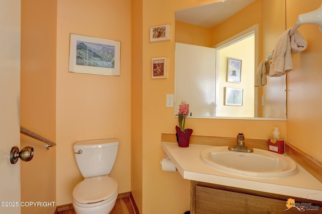 1854 Buccaneer Pl, Anchorage, AK 99501 - half bathroom featuring vanity and toilet