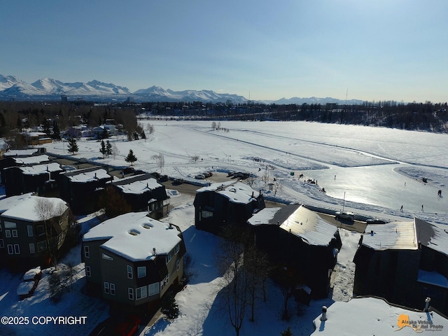 1854 Buccaneer Pl, Anchorage, AK 99501 - snowy aerial view with a mountain view