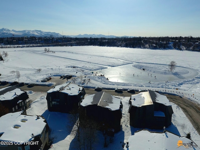 1854 Buccaneer Pl, Anchorage, AK 99501 - snowy aerial view with a mountain view