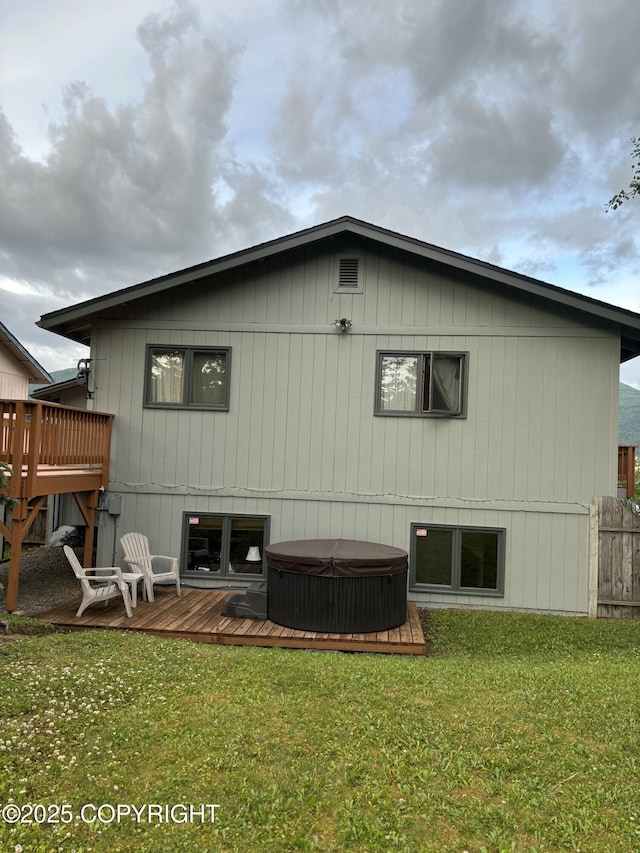 1900 Rebel Ridge Dr, Anchorage, AK 99504 - back of property with a hot tub and a deck
