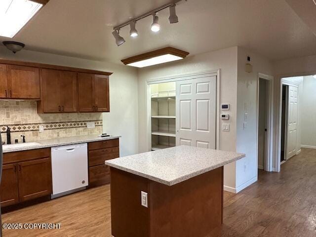 950 E Chugach View Dr, Wasilla, AK 99654 - kitchen featuring white dishwasher, light wood finished floors, and light countertops
