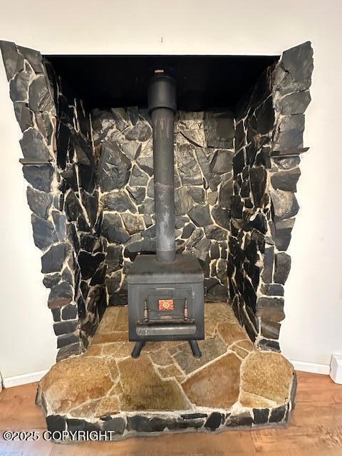950 E Chugach View Dr, Wasilla, AK 99654 - detailed view of a wood stove and wood finished floors