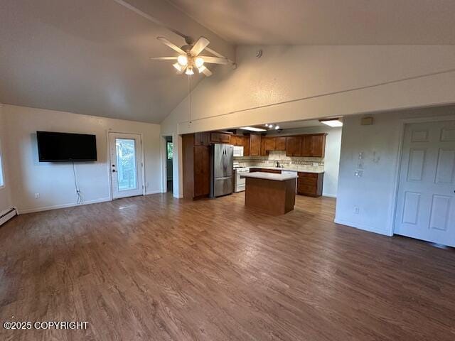 950 E Chugach View Dr, Wasilla, AK 99654 - unfurnished living room featuring a ceiling fan, beam ceiling, high vaulted ceiling, and dark wood-style flooring