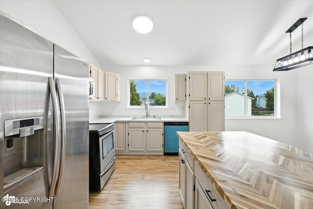 1250 W Josselin Ln, Palmer, AK 99645 - kitchen with stainless steel appliances, butcher block counters, light wood finished floors, and pendant lighting