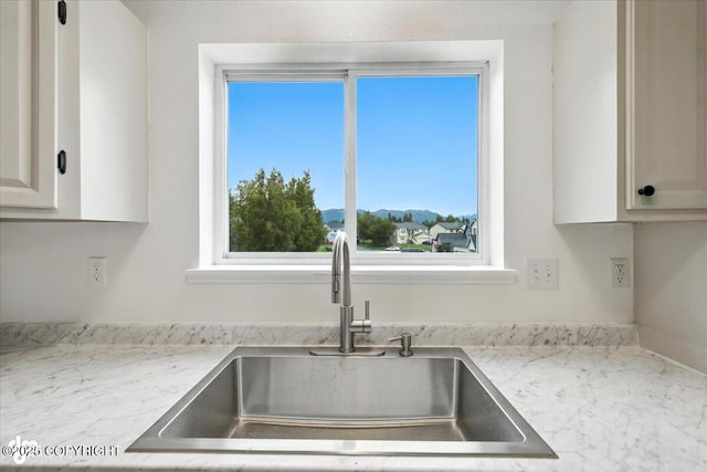 1250 W Josselin Ln, Palmer, AK 99645 - kitchen with light stone countertops and white cabinets
