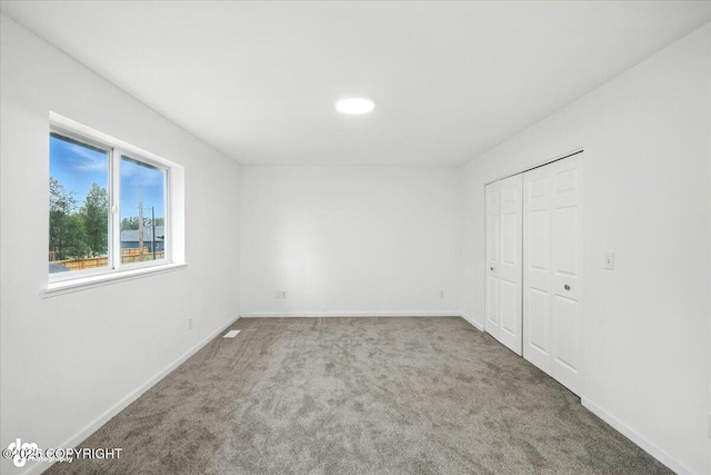 1250 W Josselin Ln, Palmer, AK 99645 - unfurnished bedroom featuring carpet flooring and a closet