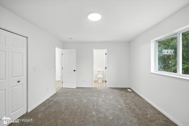 1250 W Josselin Ln, Palmer, AK 99645 - unfurnished bedroom featuring carpet floors and connected bathroom