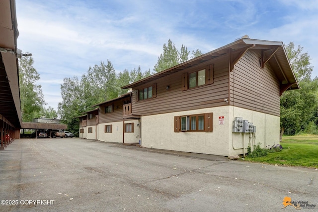 4840 Bryn Mawr Ct Unit 3, Anchorage, AK 99508 - view of side of home with stucco siding