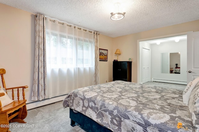 4840 Bryn Mawr Ct Unit 3, Anchorage, AK 99508 - bedroom with a baseboard heating unit, a baseboard radiator, carpet floors, and a textured ceiling