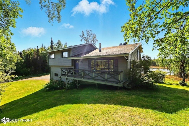 43725 Ross Dr, Soldotna, AK 99669 - view of front of home featuring a front yard and a wooden deck