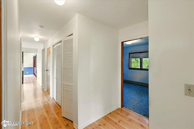 43725 Ross Dr, Soldotna, AK 99669 - corridor with a baseboard radiator and light wood-style floors