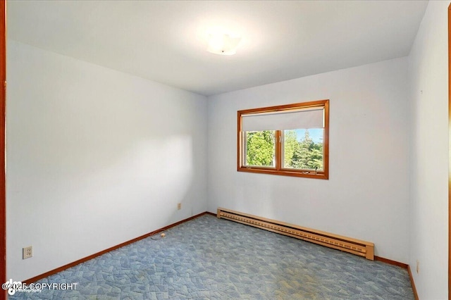 43725 Ross Dr, Soldotna, AK 99669 - spare room with a baseboard heating unit and carpet