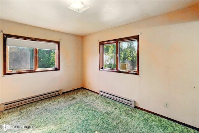 43725 Ross Dr, Soldotna, AK 99669 - empty room with a baseboard radiator, a baseboard heating unit, and carpet floors