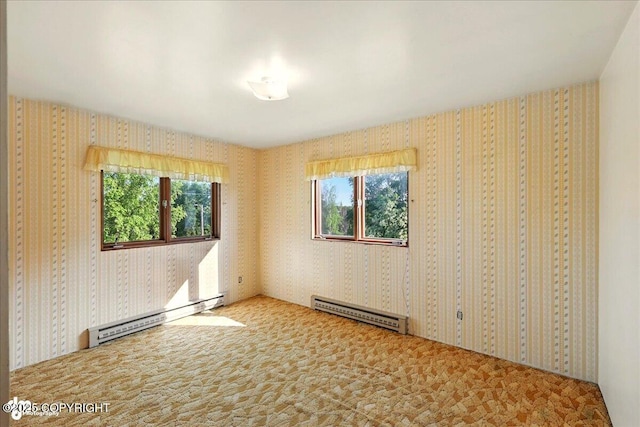 43725 Ross Dr, Soldotna, AK 99669 - unfurnished room featuring baseboard heating, a baseboard radiator, wallpapered walls, and carpet