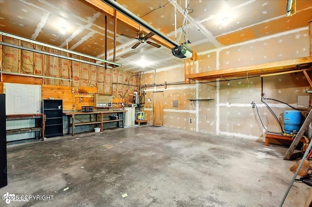 43725 Ross Dr, Soldotna, AK 99669 - garage with a garage door opener and a workshop area