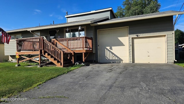2090 Dimond Dr, Anchorage, AK 99507 - view of front facade featuring asphalt driveway, a garage, a front lawn, covered porch, and stairway