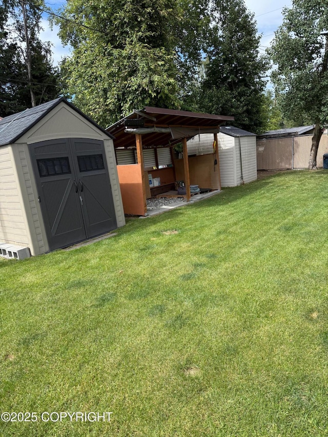 2090 Dimond Dr, Anchorage, AK 99507 - view of green lawn featuring a storage unit